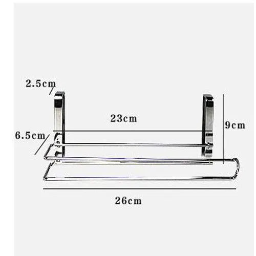 Silver stainless steel paper towel rack hanging on a kitchen cabinet door