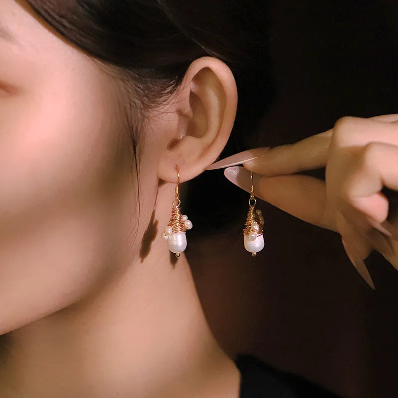 Handmade natural pearl embellished wire-wrapped earrings in geometric round shape for women