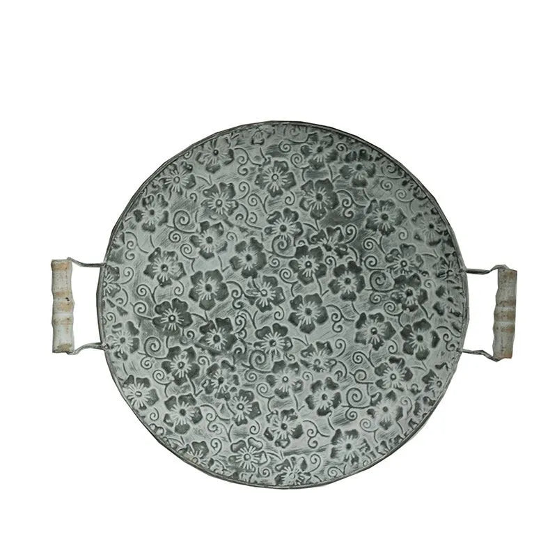 Round wrought iron belt storage tray in two sizes for home organisation.