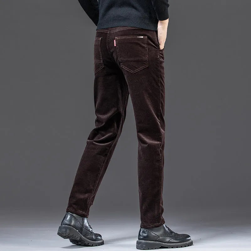 Straight slim-fit cotton corduroy trousers in black, side view, mid-waist, zip-placket fly