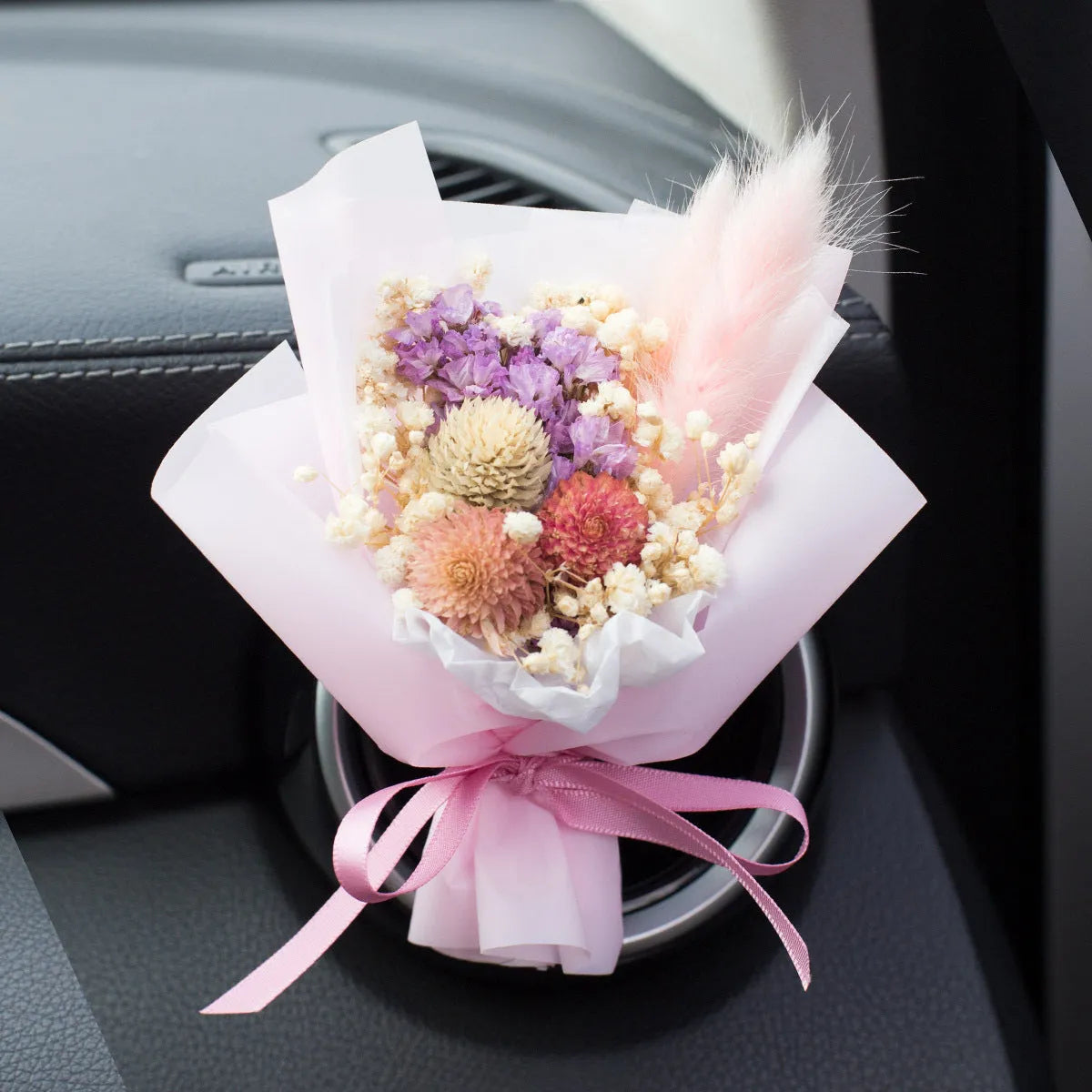 Handmade dried flower car air freshener ornament in multiple colours mounted on car vent