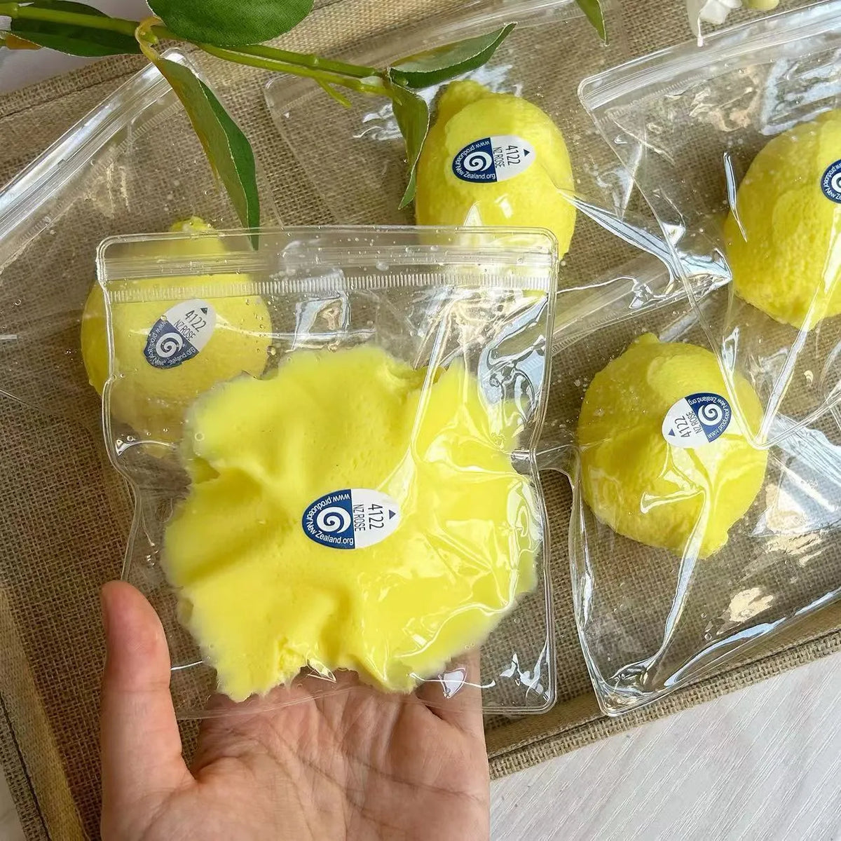 Silicone lemon squeezing toy in silicone lemon colour for pressure reduction and grasp training