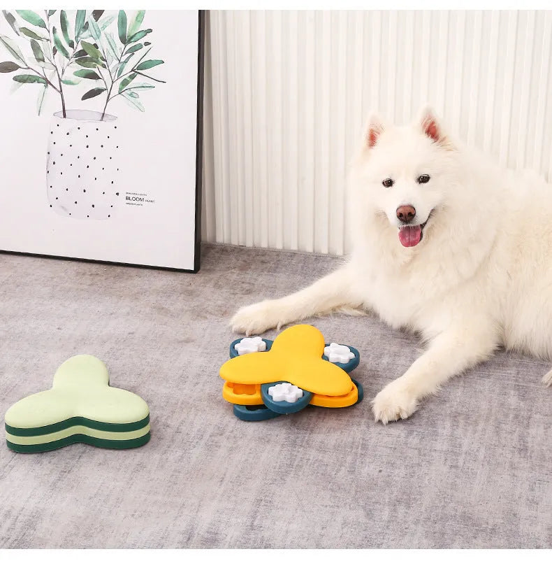 Green and yellow dog puzzle toy with rotatable treat dispenser and nine bone-shaped compartment covers