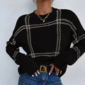 Women's loose fit plaid colour-block acrylic sweater with crew neck in striped apricot, black, beige, red, and green.