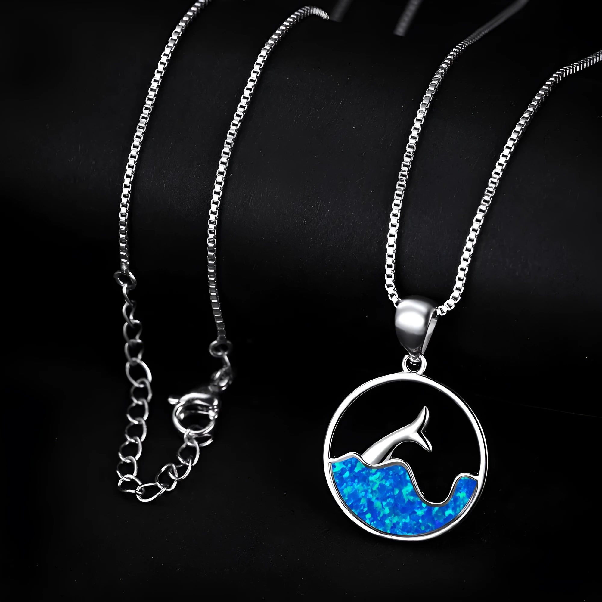 Geometric sea fishtail pendant necklace with an electroplated white gold finish and an opal colour variant.
