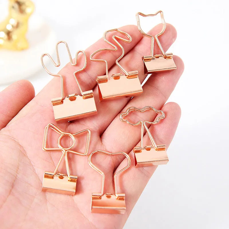 Gold metal office clip with long tail and decorative charm options including flamingo, love, clouds, cat, cactus and bow designs