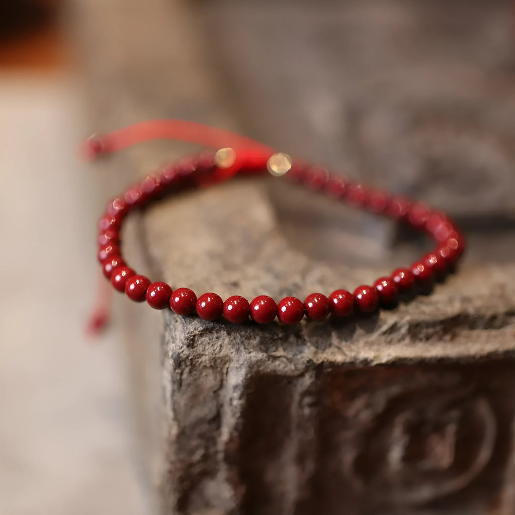 Handmade natural cinnabar bracelet with purple gold sand design and geometric Chinese auspicious patterns
