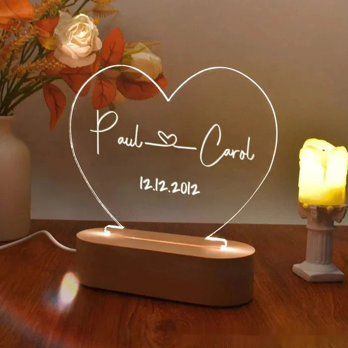 Personalised acrylic night light with engraved names and date, measuring 20cm by 11.5cm