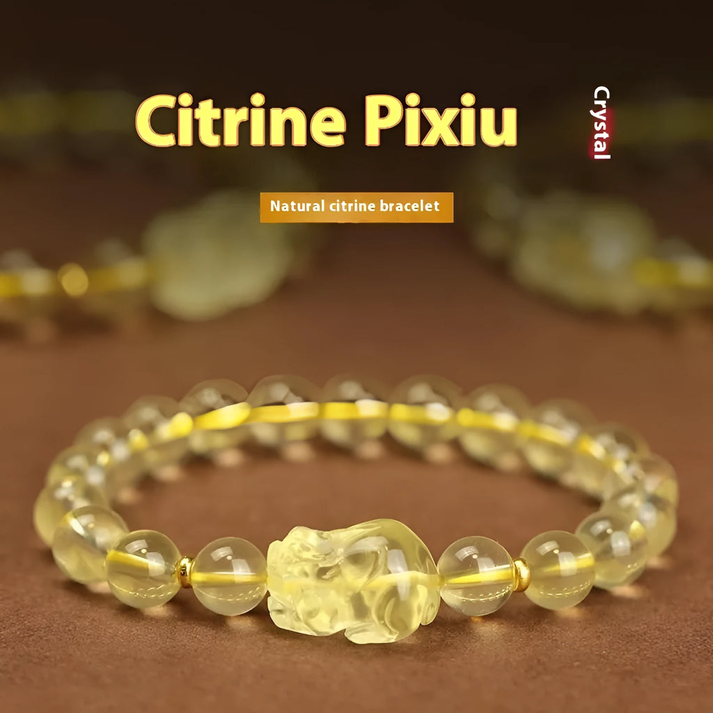Yellow leather bracelet with artificial crystal beads and a Pi Xiu charm in simple Chinese style.