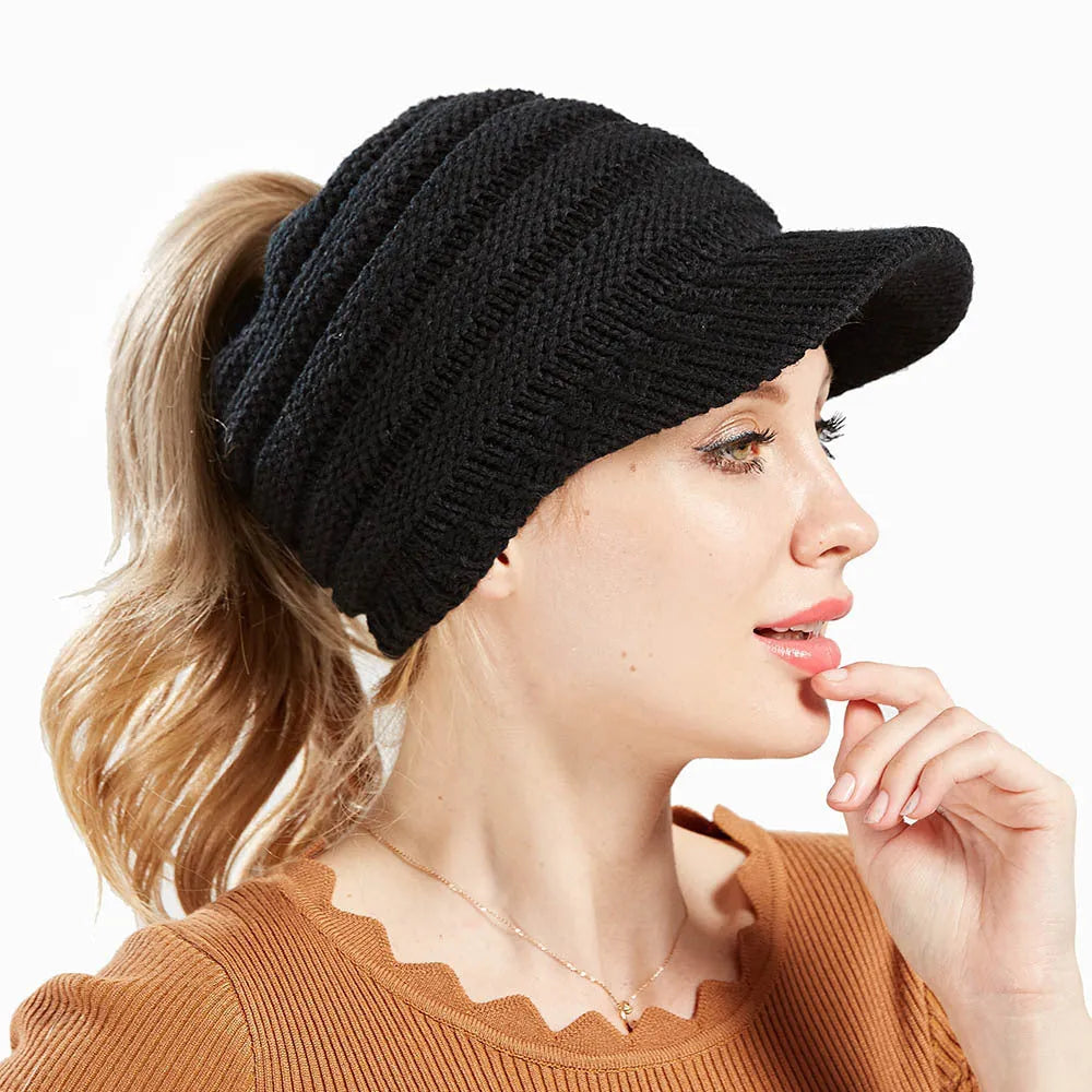 Women's knitted beanie with ponytail hole in acrylic yarn for winter wear