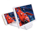 Black and white 3D mobile phone screen amplifier with built-in adjustable stand on a table.
