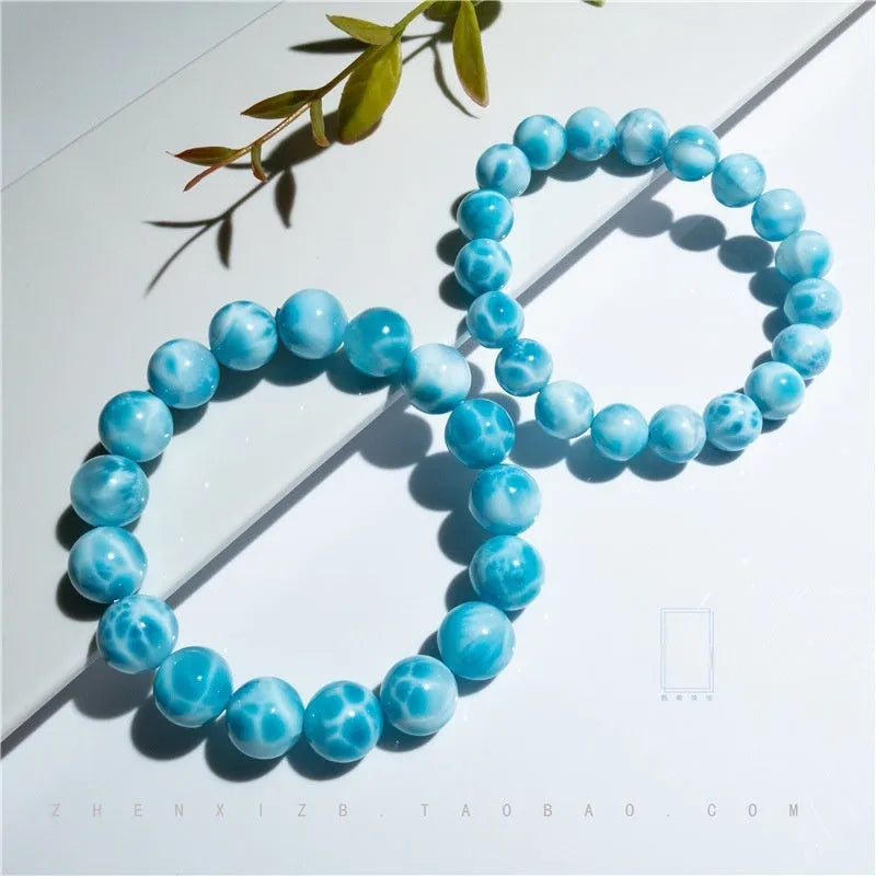 Blue Bodhi bracelet with pearl elements, showing Maillard style and range of bead sizes.