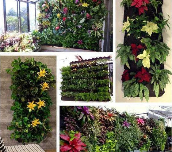 Green felt vertical wall planter with multiple planting pockets hanging on an outdoor wall