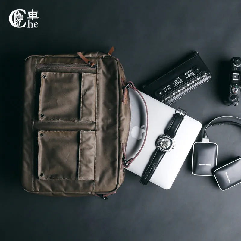 Dpark black laptop messenger bag for 15-inch Apple Lenovo computers on a shoulder.