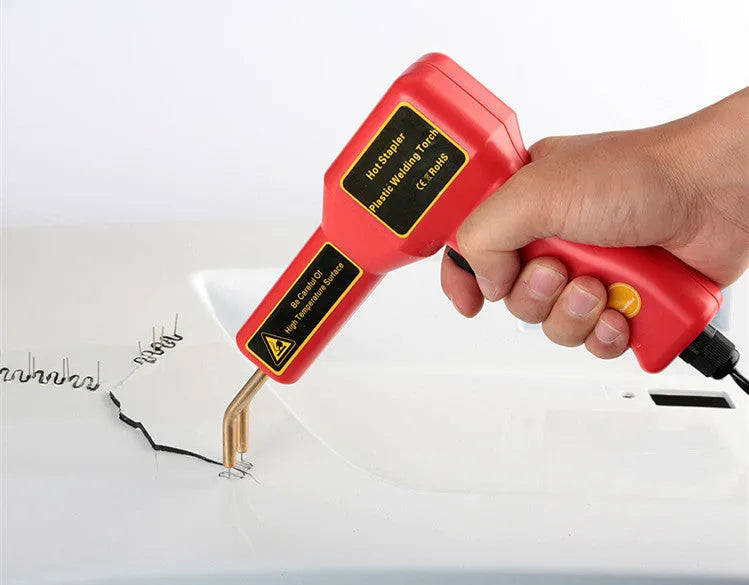 Red CR307 model 30W plastic welding gun for car bumper repair on a workbench.