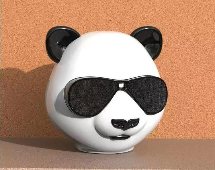 Classic style portable mini Bluetooth speaker showing front grille and compact design.