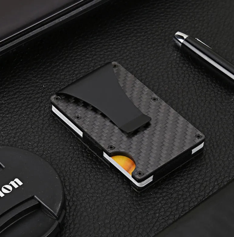 Black carbon fiber and aluminum RFID anti-magnetic card holder wallet on flat surface