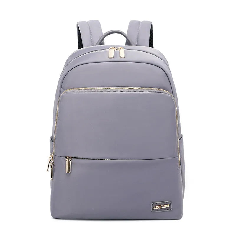 Women's large capacity oxford cloth backpack in black, showing front compartments and shoulder straps.