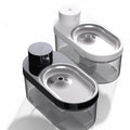 Black wireless stainless steel pet water dispenser with built-in battery for cats and dogs on a floor