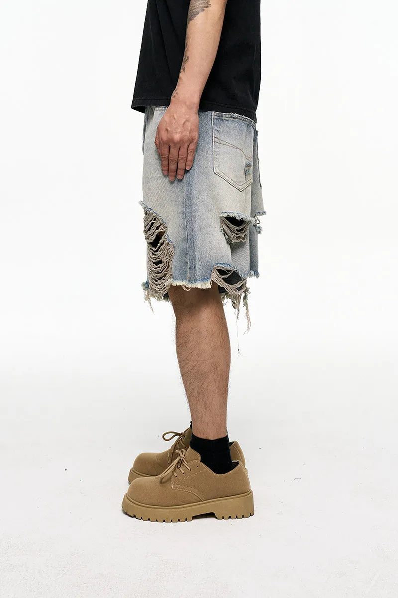 Light blue baggy denim shorts with wide leg cut and zipper fly