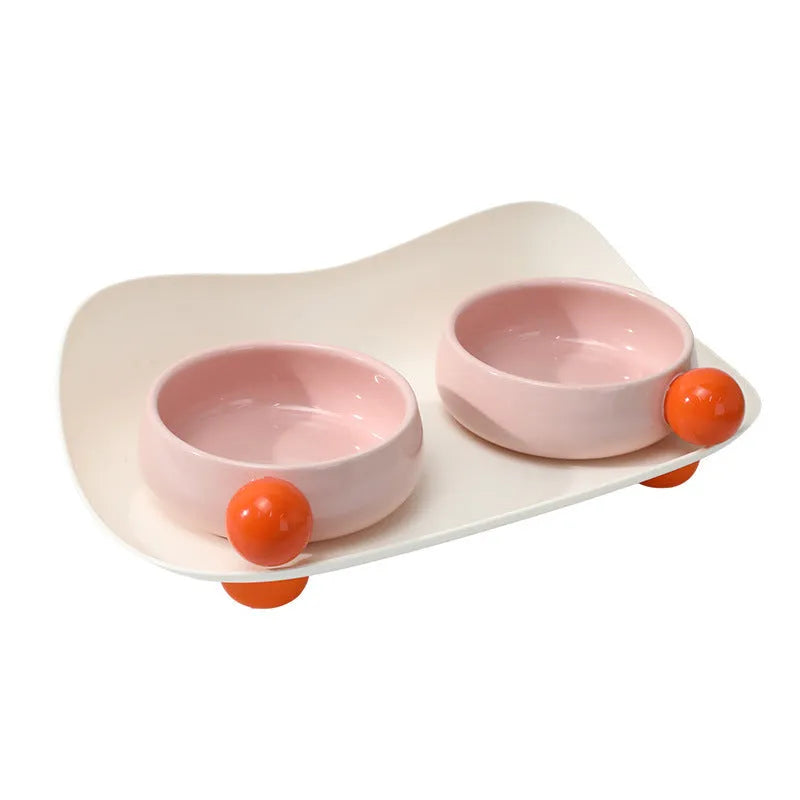 Elevated ceramic double bowl set for cats and small pets with non-slip base in pink, yellow or mixed colours