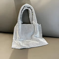 Silver shiny rhinestone handbag made of cotton thread with open pocket, designed for evening parties and dinners.