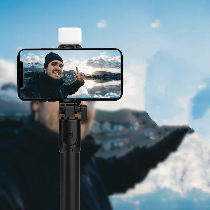 Black Bluetooth selfie stick tripod with phone holder showing 360-degree rotating head and aluminium alloy construction