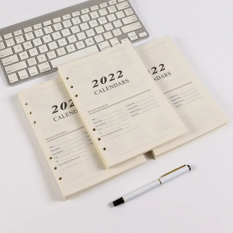 A5 white loose-leaf notebook inner pages with monthly plan layout on paper