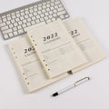 A5 white loose-leaf notebook inner pages with monthly plan layout on paper