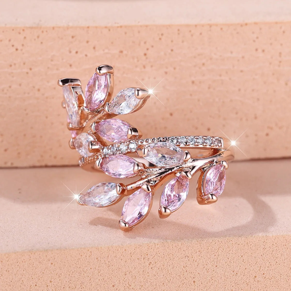 Adjustable leaf-shaped ring with horse eye cubic zirconia design in copper with rose gold plating