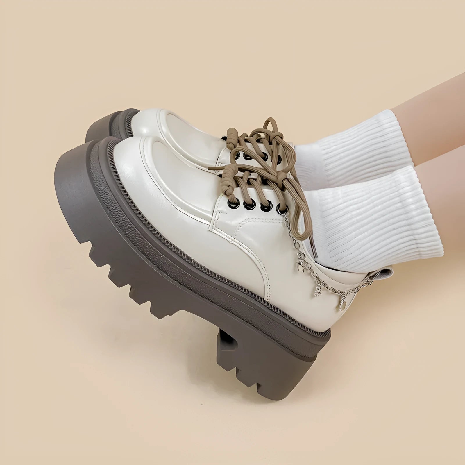 White platform Mary Jane leather shoes with chunky heel and lace-up closure