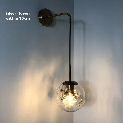 Modern glass bedside wall lamp in golden flower or silver flower finish