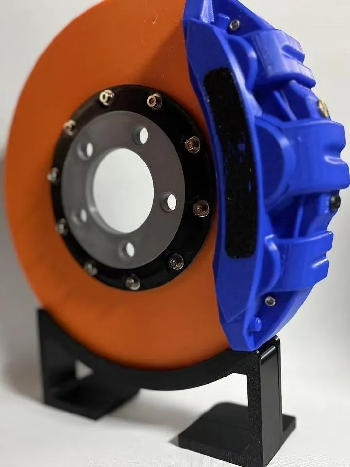 Blue brake disc LED night light with bracket on desk, showing 24cm disc and touch switch