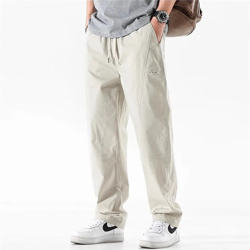 Cotton wide-leg casual trousers in milky white and black colours, showcasing the relaxed fit.