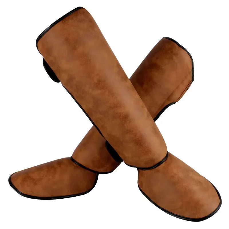 PU vertical thickened fighting boxing shin guards in brown colour on training mat