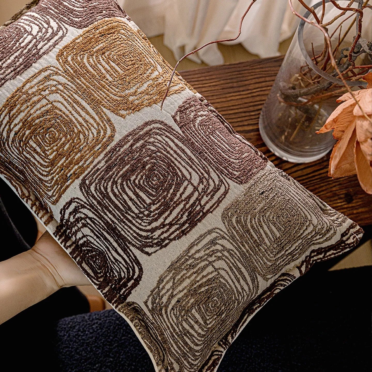 Cream and coffee coloured abstract coil pattern square pillow cover made from polyester feather velvet.