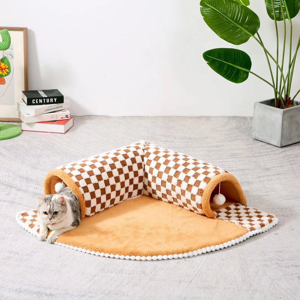 Fan-shaped plush pet bed with integrated tunnel in coffee colour, showing thick mat and anti-slip base.