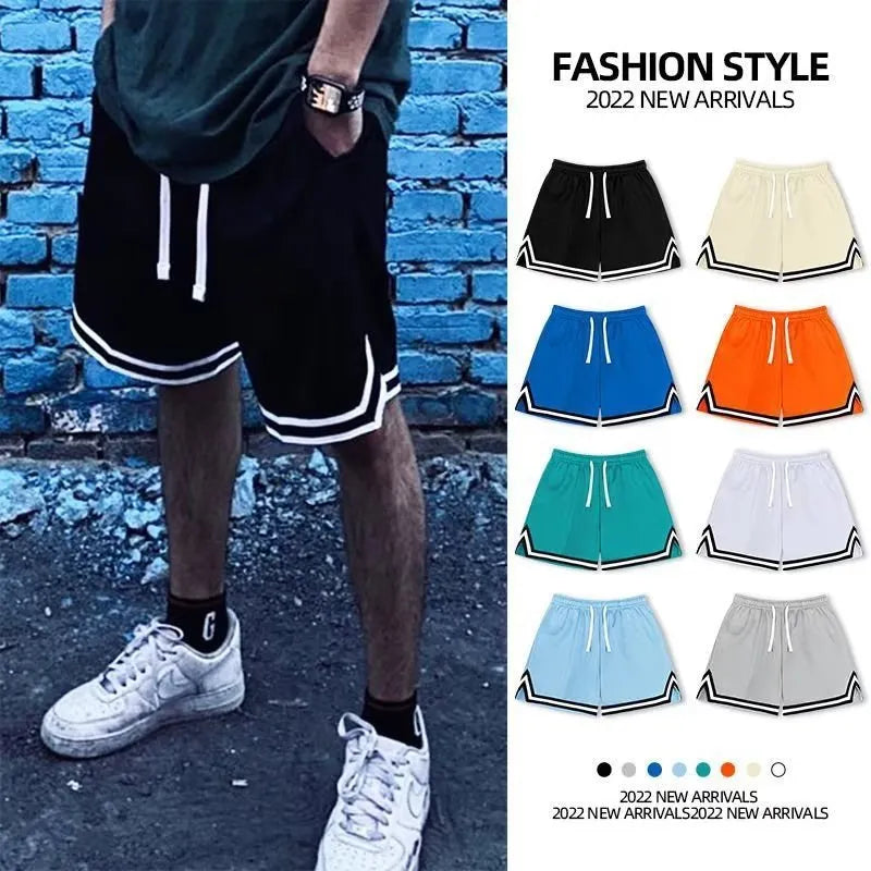 Men's loose blue sports shorts made from polyester fabric on a plain background.