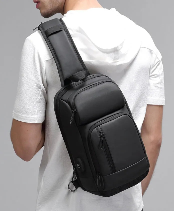 Black medium-sized PVC outdoor shoulder bag showing front view and interior laptop compartment.