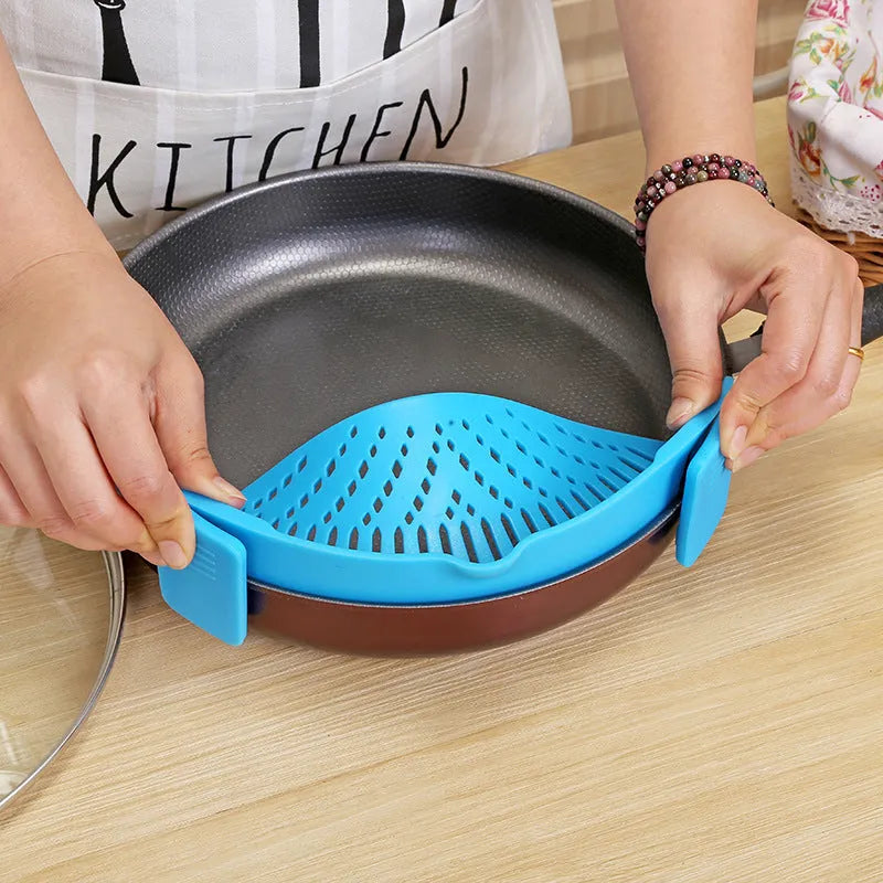 Silicone clip-on kitchen strainer with stainless steel mesh attached to cooking pot