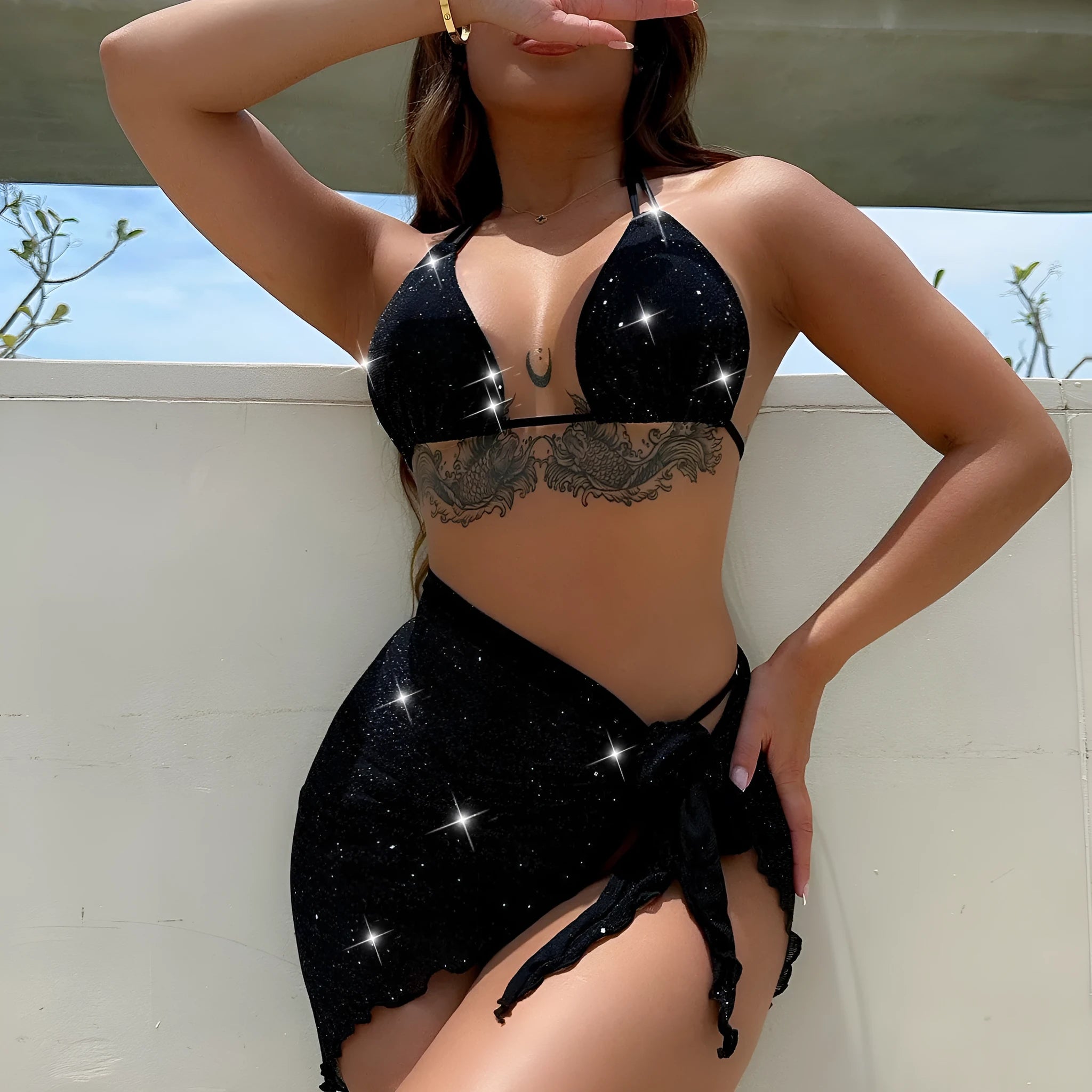 Black women's three-piece bikini swimsuit set with shorts on a mannequin