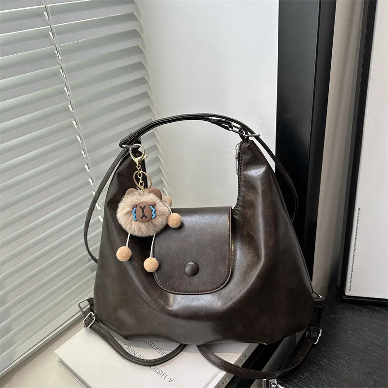 Women's PU leather shoulder bag with single strap in urban simplicity style showing horizontal square shape