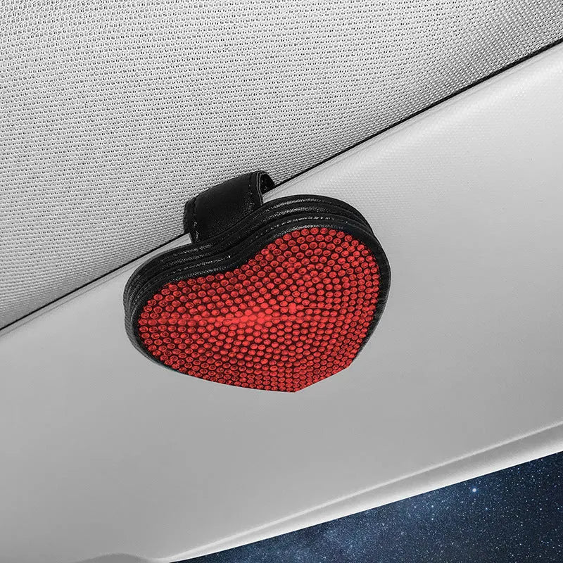 Black diamond-encrusted PU leather car sun visor clip holding sunglasses and a ticket.