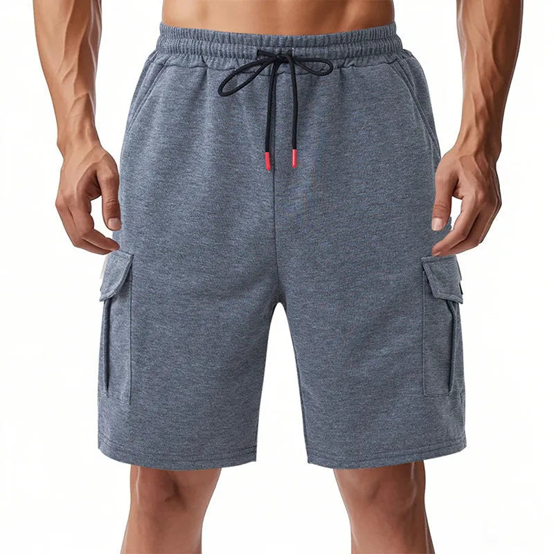 Loose fit sports cargo shorts with multiple pockets in light grey, showing elastic waistband and fifth pants length