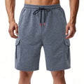 Loose fit sports cargo shorts with multiple pockets in light grey, showing elastic waistband and fifth pants length