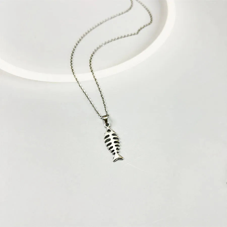 Fishbone motif pendant necklace and matching earrings set in retro-style alloy jewellery with adjustable chain.