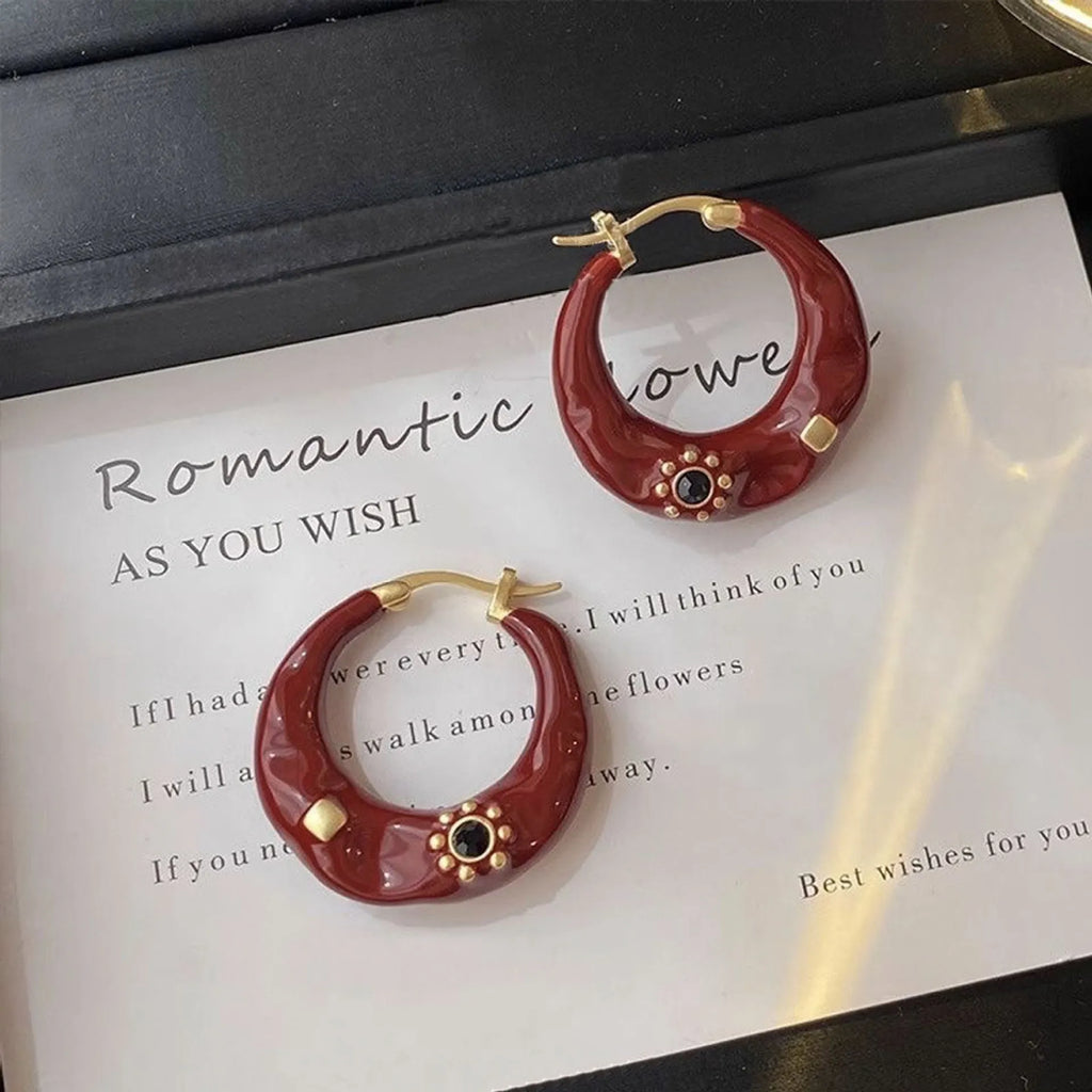 Hong Kong style retro ear studs with drip oil texture and rhinestone decoration in black and red colours