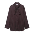 Brown women's loose-fit poplin shirt with long sleeves and a built-in bow tie detail.