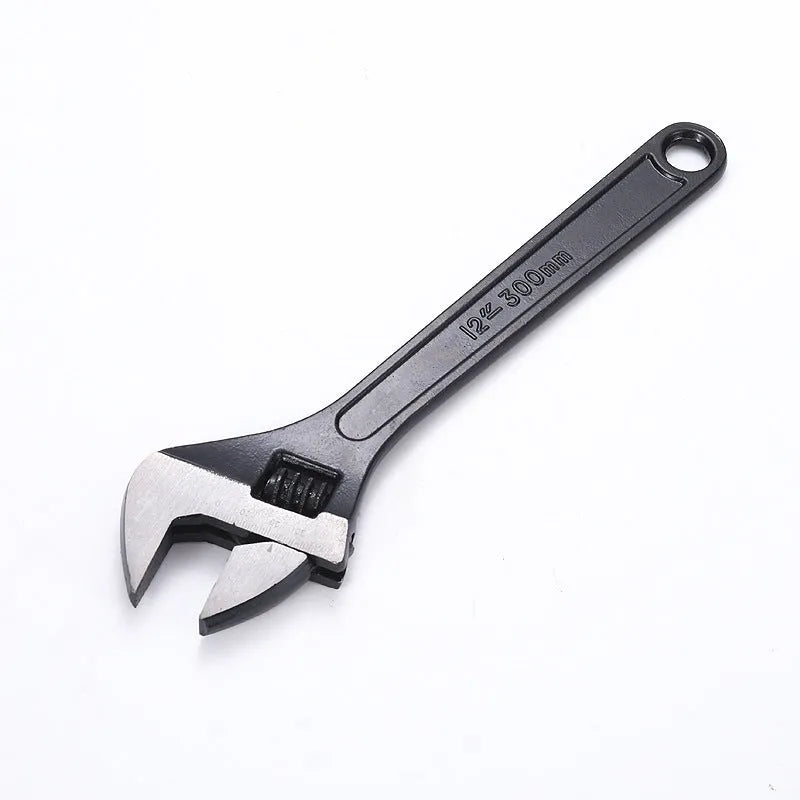 10-inch black high carbon steel adjustable open-end wrench on a workbench.