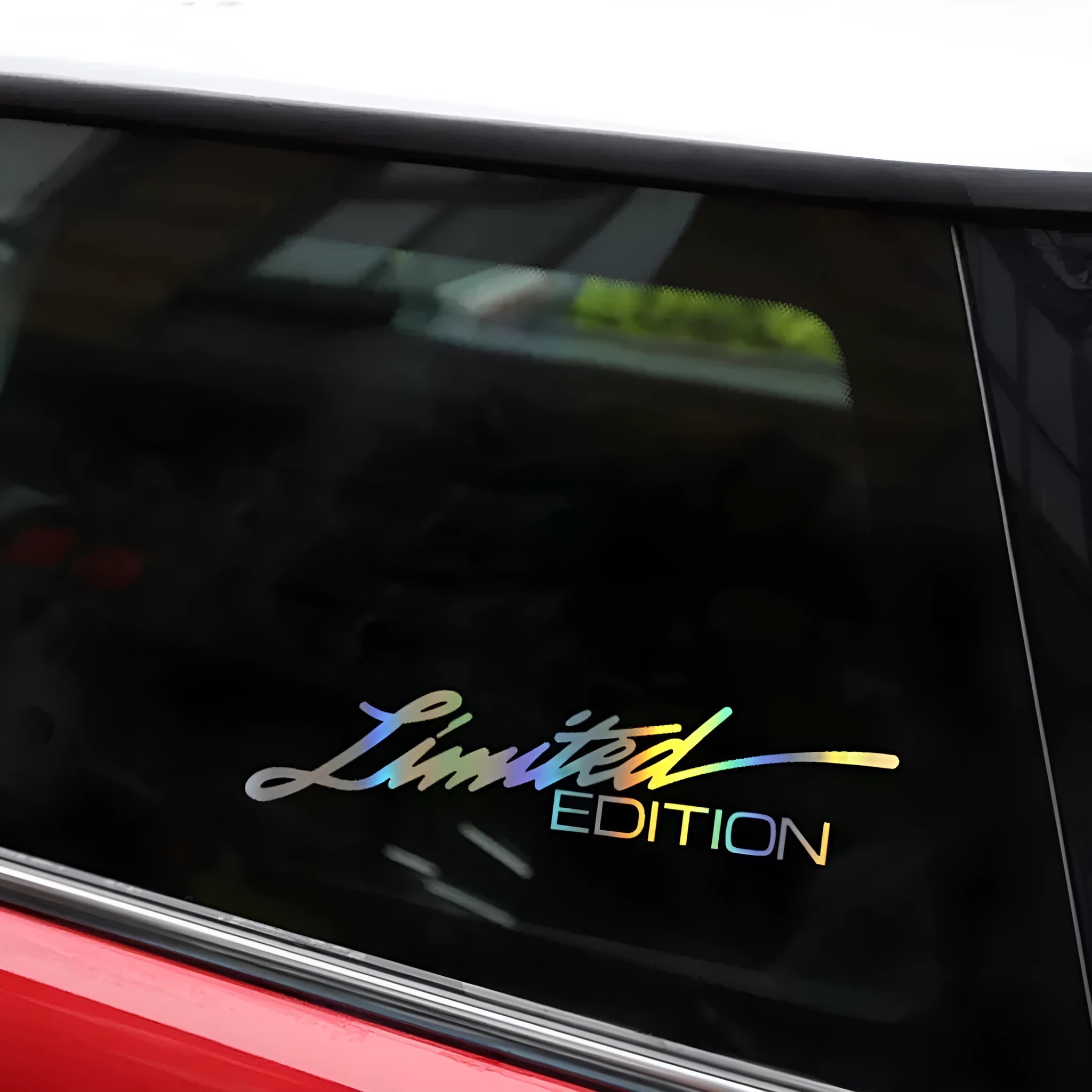 Black laser reflective car sticker with text design on PET material for vehicle personalisation.